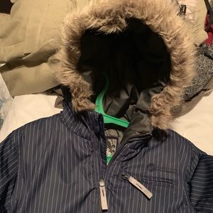 Ski jacket , navy fur hood , lots of pockets